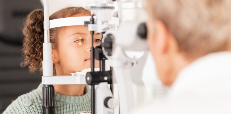 baby girl having eye exam